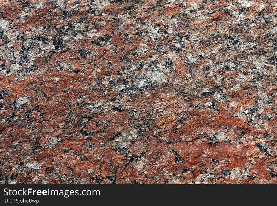 Stone background, granite. Red, white, black and grey color. Stone background, granite. Red, white, black and grey color.