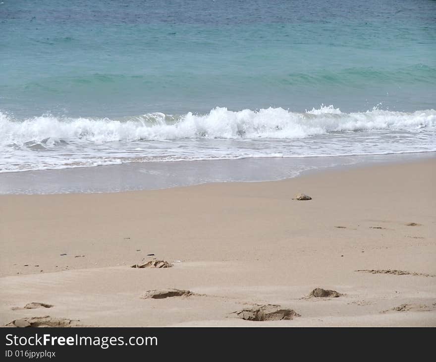 Porthcurno beach Cornwall UK. A sunny day in early June just after rain. Porthcurno beach Cornwall UK. A sunny day in early June just after rain.