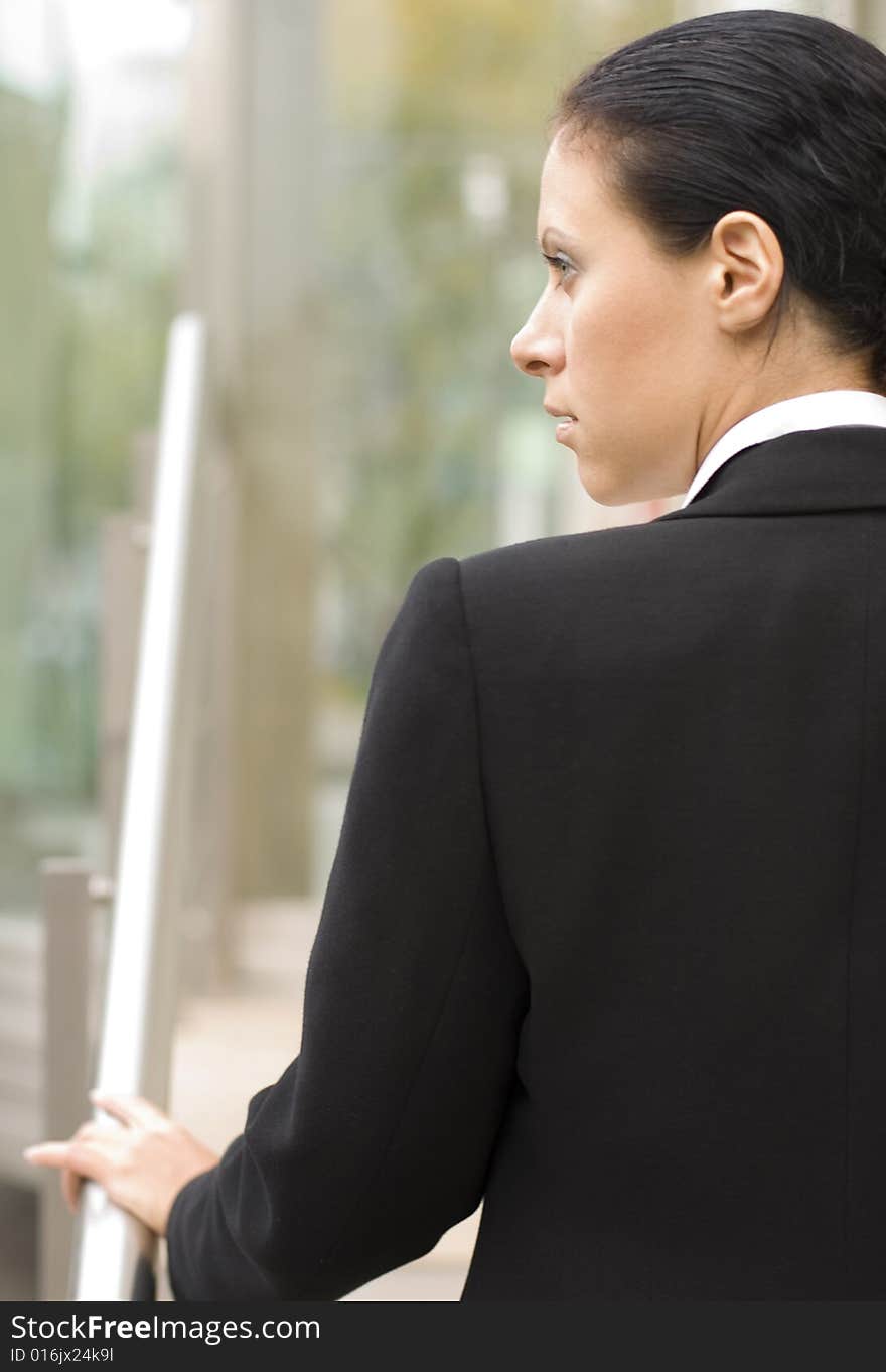 Outdoor closeup portrait of businesswoman in black