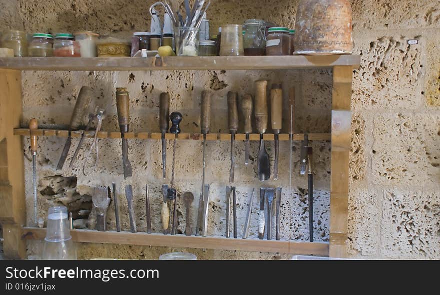 Where a sculptor works, tools in a rack. Where a sculptor works, tools in a rack.