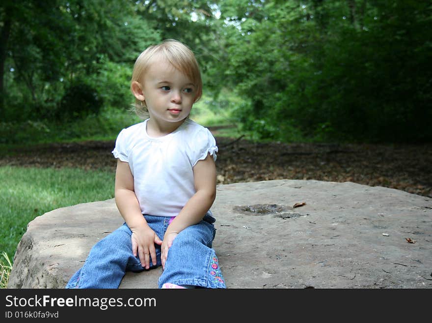 Toddler looking annoyed by all the photos taken of her. Toddler looking annoyed by all the photos taken of her