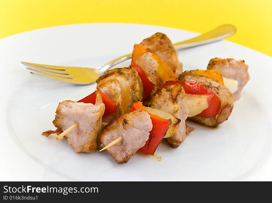 Two skewer with onion and vegetables