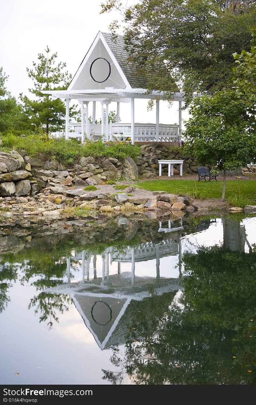 Wedding gazebo sitting on the side of a lake. Wedding gazebo sitting on the side of a lake