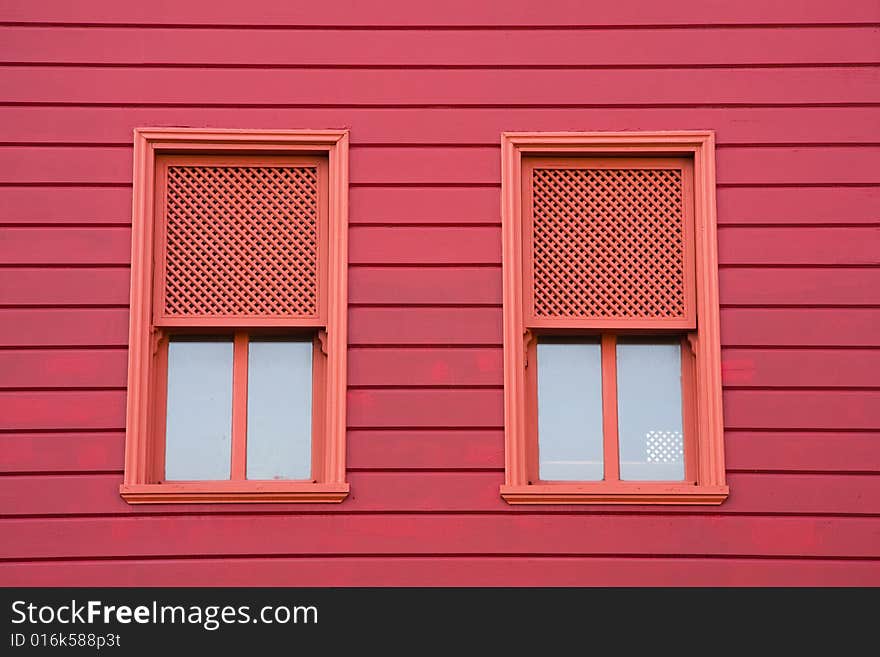 Red windows of red old house. Red windows of red old house.