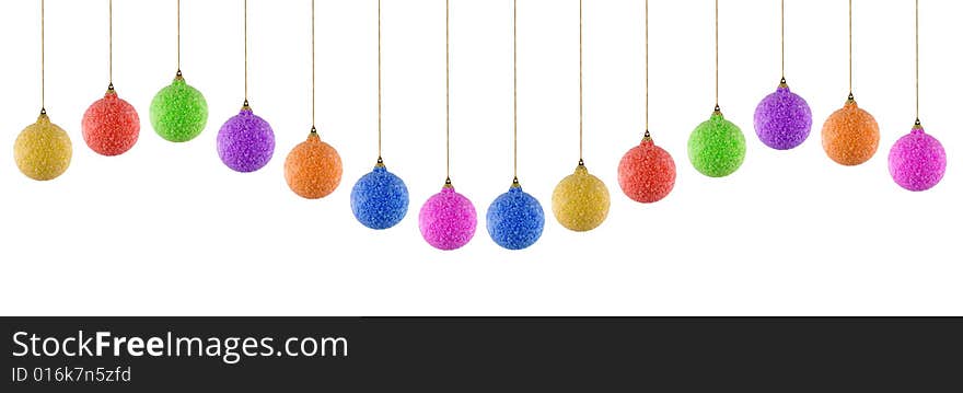 Colored christmas balls in different positions on white background