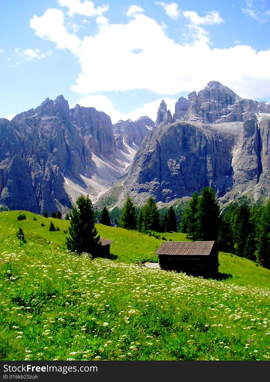 A wonderful shot of the Cir mountain in Gardena valley and a cottage in a lawn. A wonderful shot of the Cir mountain in Gardena valley and a cottage in a lawn