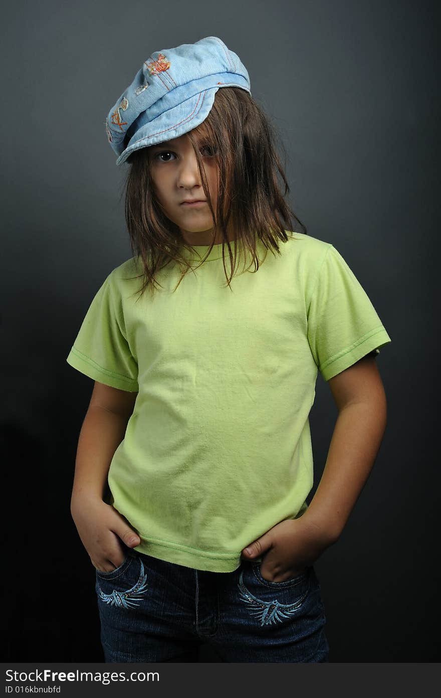 Portrait of a little girl on grey background. Portrait of a little girl on grey background