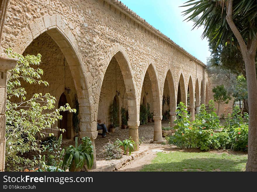 Passway between wall and pillars. Ancient architecture in Cyprus