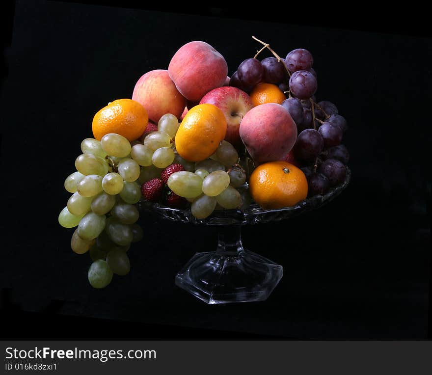 Fresh fruits on black background