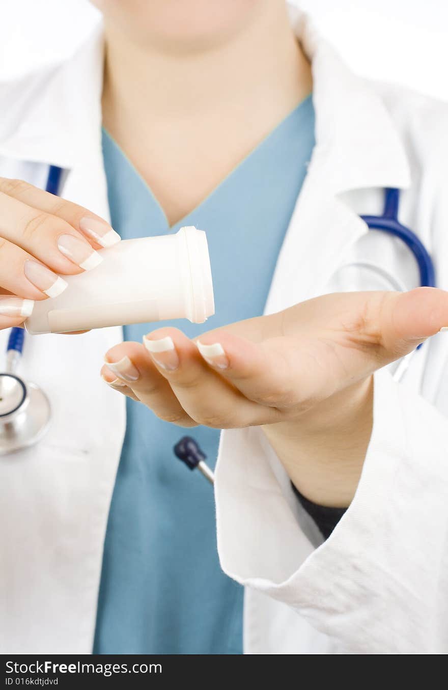 Close up of doctor holding a bottle of pills isolated on white. Close up of doctor holding a bottle of pills isolated on white