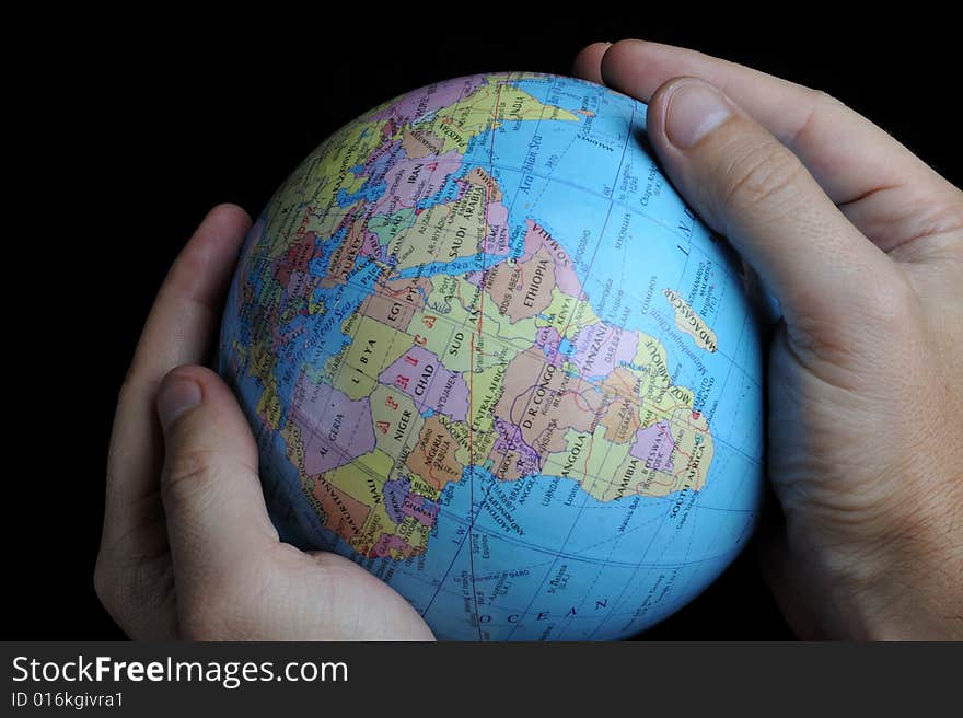 Close-up of Earth globe holded in hands. Close-up of Earth globe holded in hands