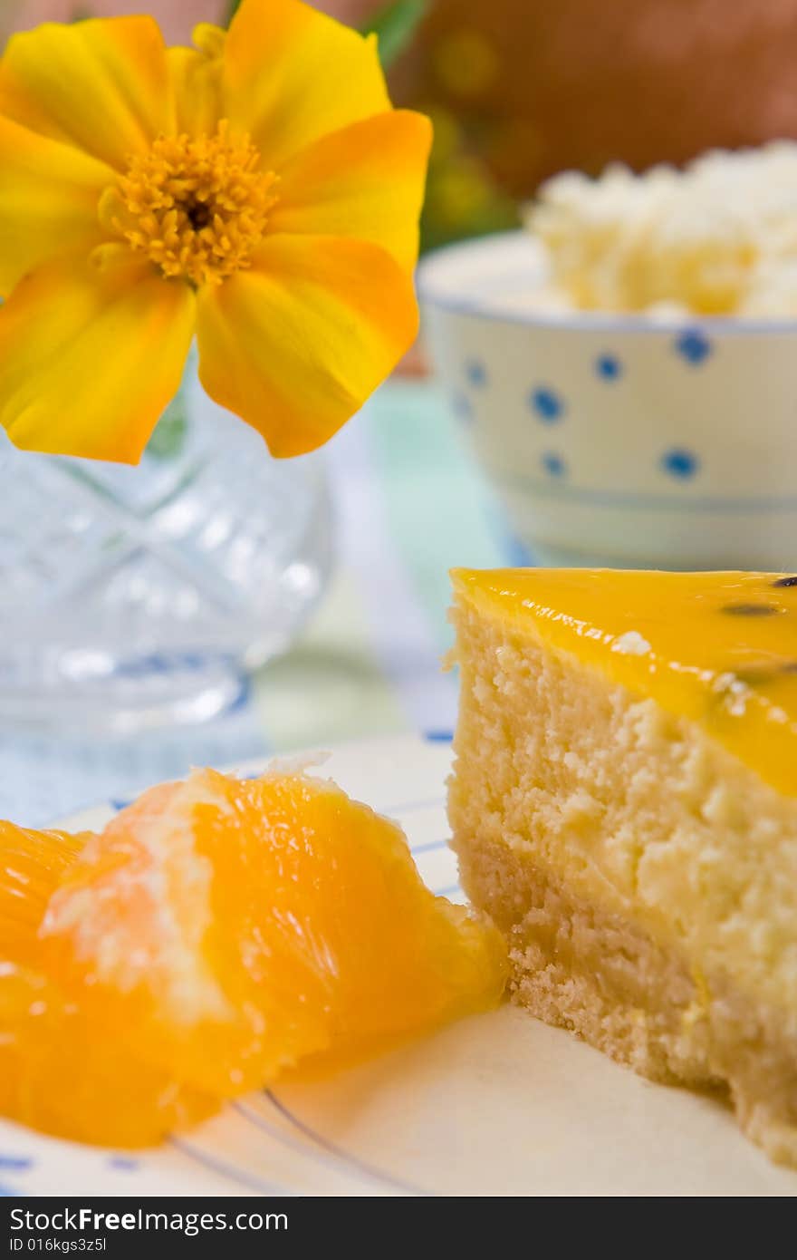 Cheesecake with fresh orange slices on a plate