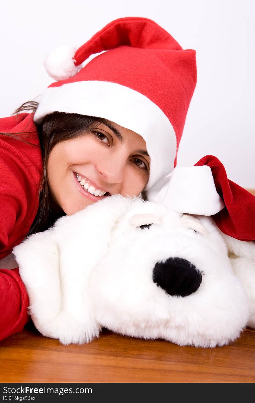 Young woman playing with toy dog in christmas - portrait orientation