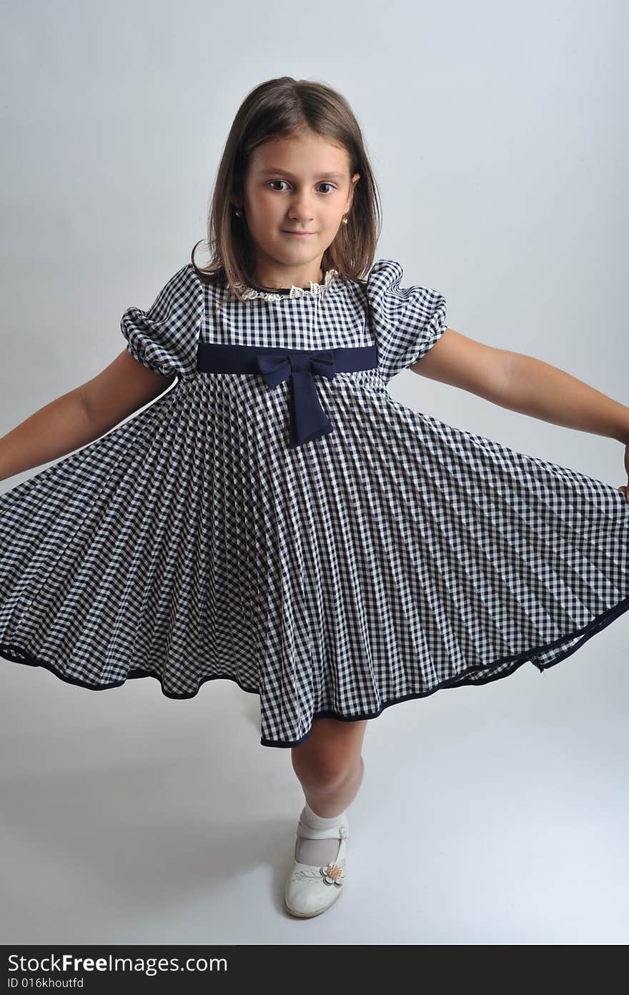 Close up portrait of a little girl dancing