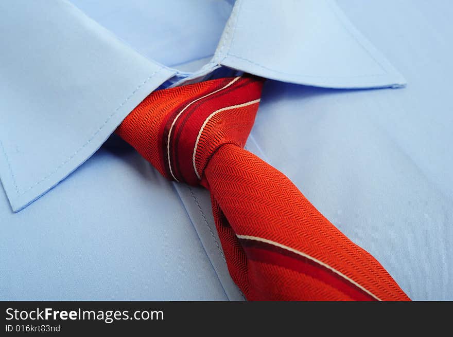 Close up of a shirt with red tie. Close up of a shirt with red tie