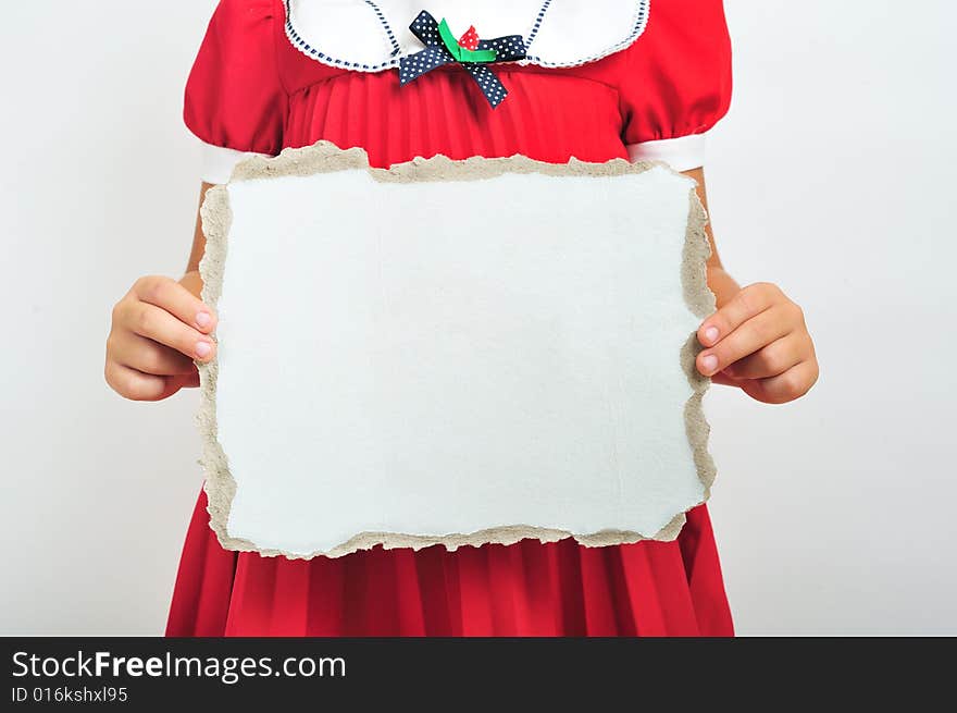 Little girl holding a blank cardboard, close up. Little girl holding a blank cardboard, close up