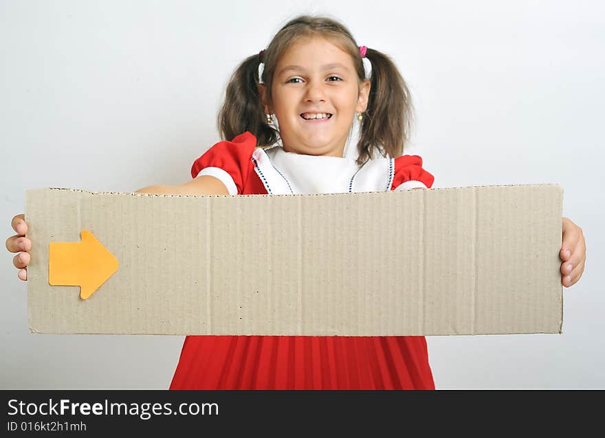 Little girl holding a blank cardboard, close up