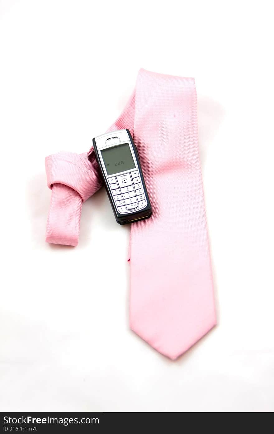 Tie and cell phone on a white background