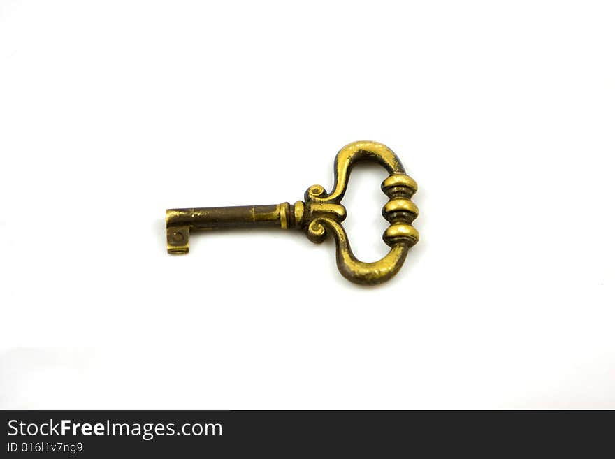 Golden key on a white background