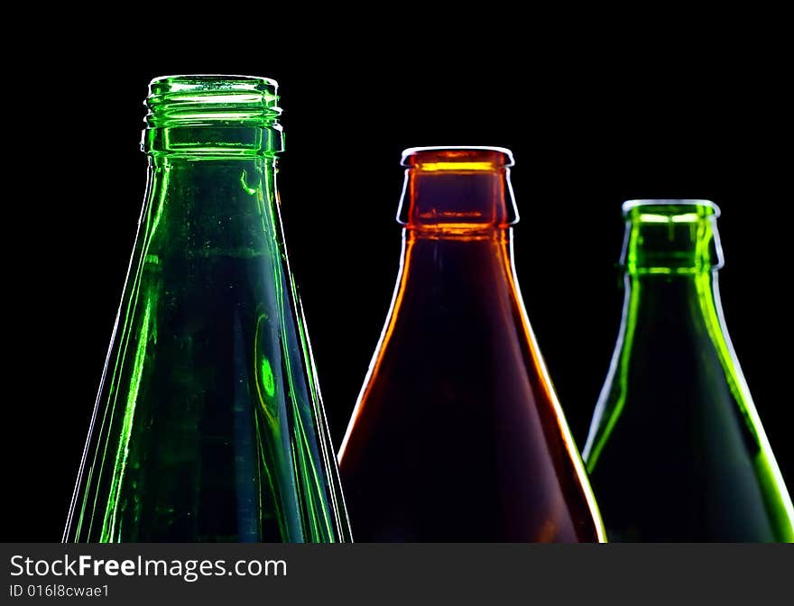 Empty bottles isolated on black