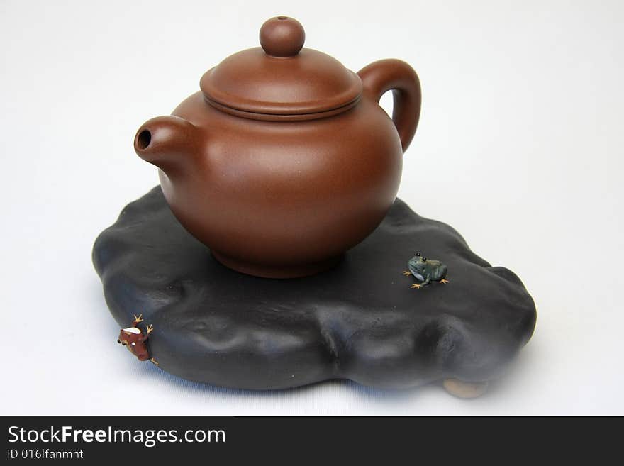 An square teapot on white background,also called zisha teapot in China.