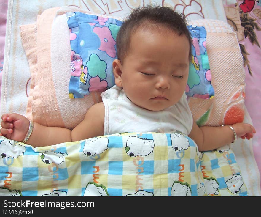 Sleeping Baby on a bed