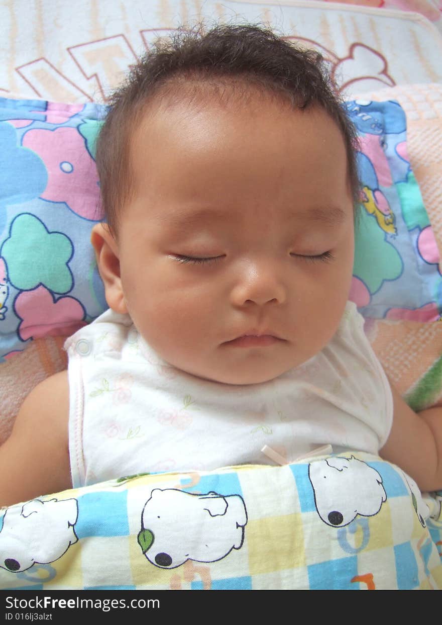 Sleeping Baby on a bed