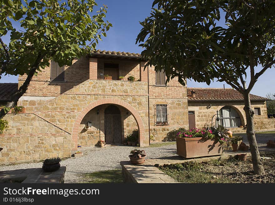 The garden of a luxury country house in the famous Tuscan hills, Italy. The garden of a luxury country house in the famous Tuscan hills, Italy.