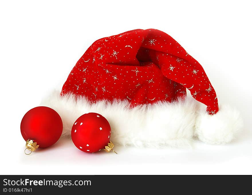 Close up of a Santa Claus hat and two spheres. Close up of a Santa Claus hat and two spheres