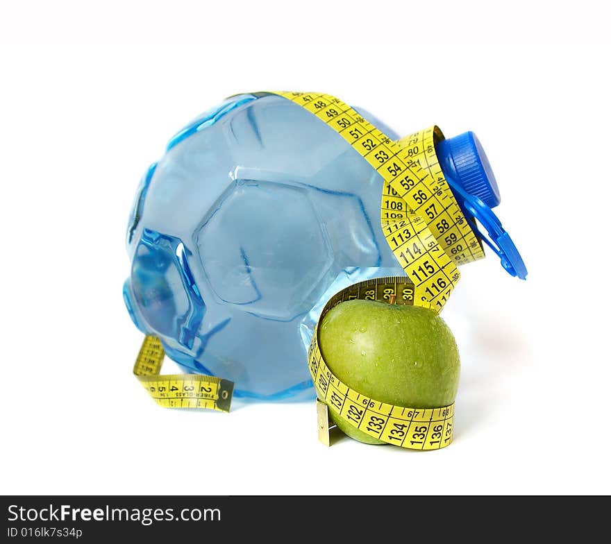 Plastic bottle of water and green apple. Plastic bottle of water and green apple