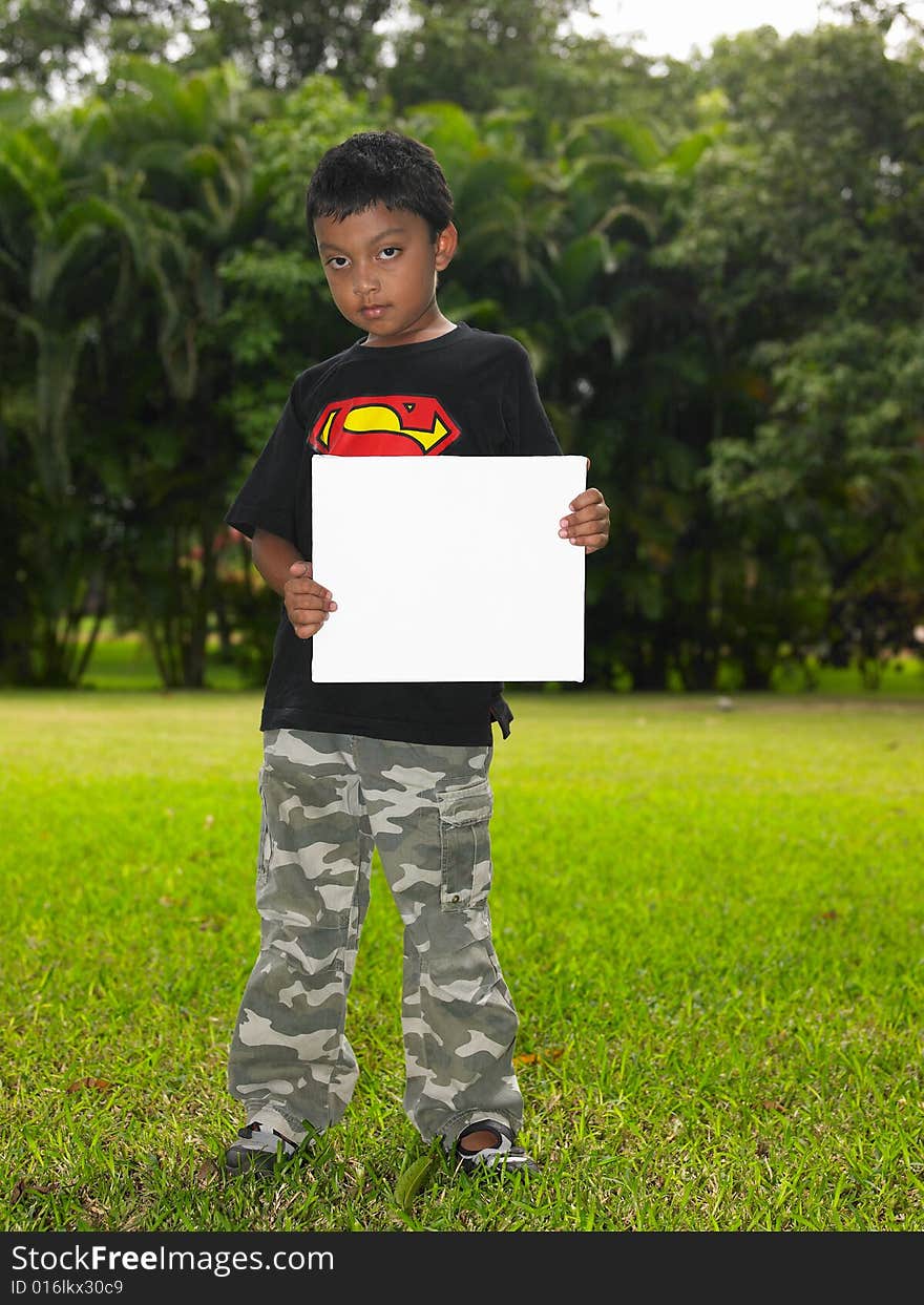 Asian Boy Holding A Placard