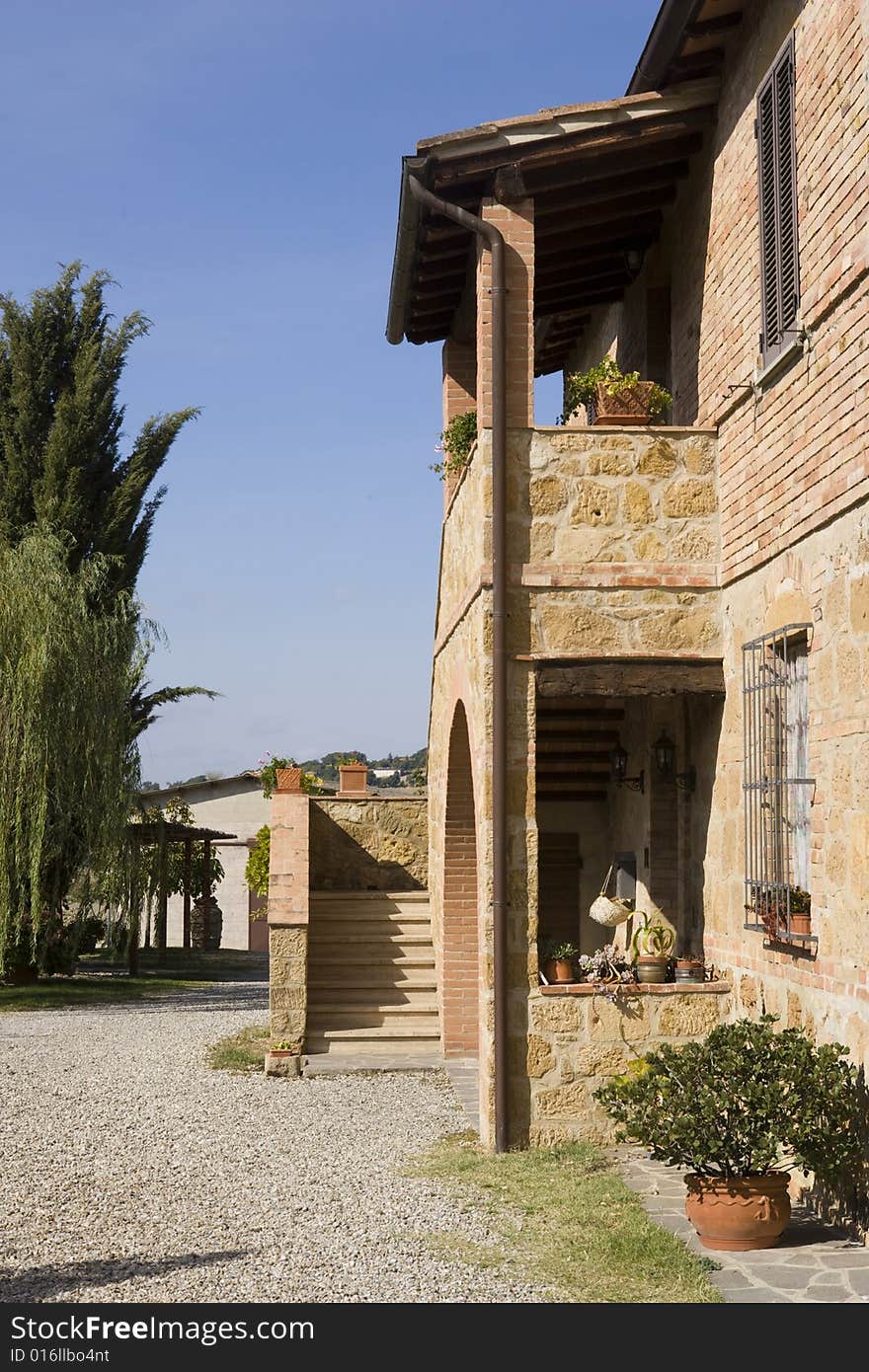 The garden of a luxury country house in the famous Tuscan hills, Italy. The garden of a luxury country house in the famous Tuscan hills, Italy.