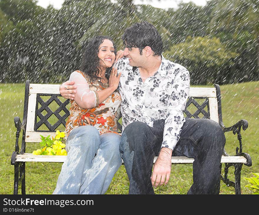 Asian couple of indian origin in the drizzle. Asian couple of indian origin in the drizzle