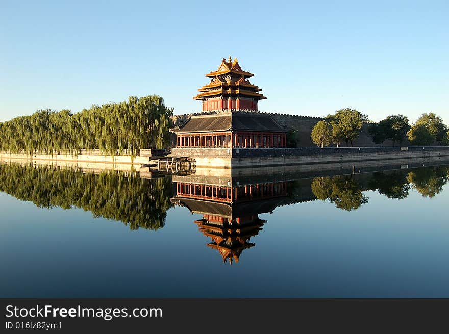 Turret, wall, willows and their reflections in moat, shot at northeast corner of forbidden city, Beijing China. Turret, wall, willows and their reflections in moat, shot at northeast corner of forbidden city, Beijing China.