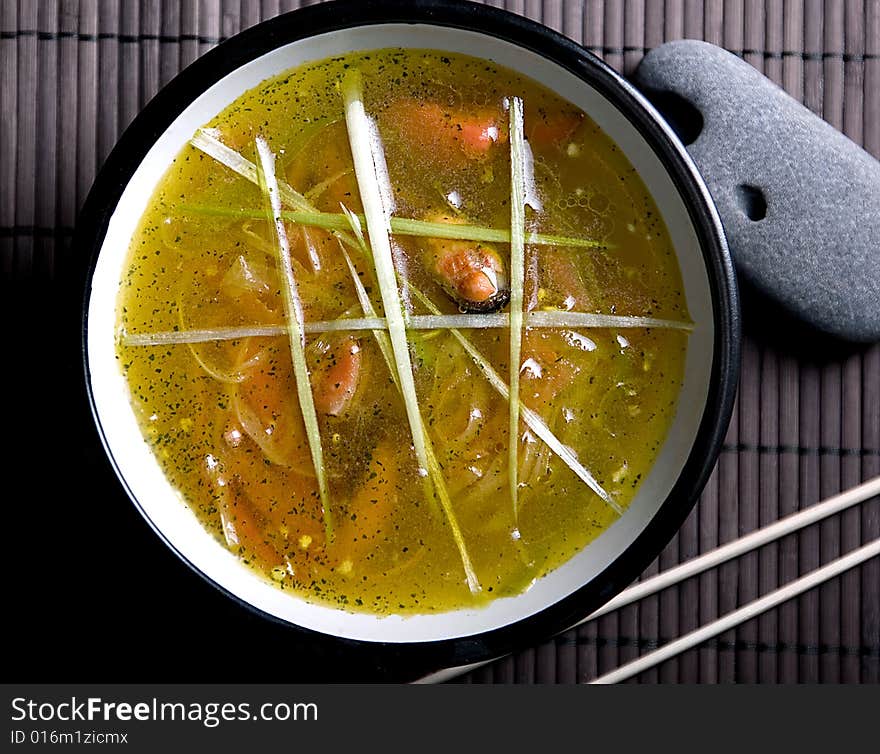 Soup with mussels in the bowl. Soup with mussels in the bowl