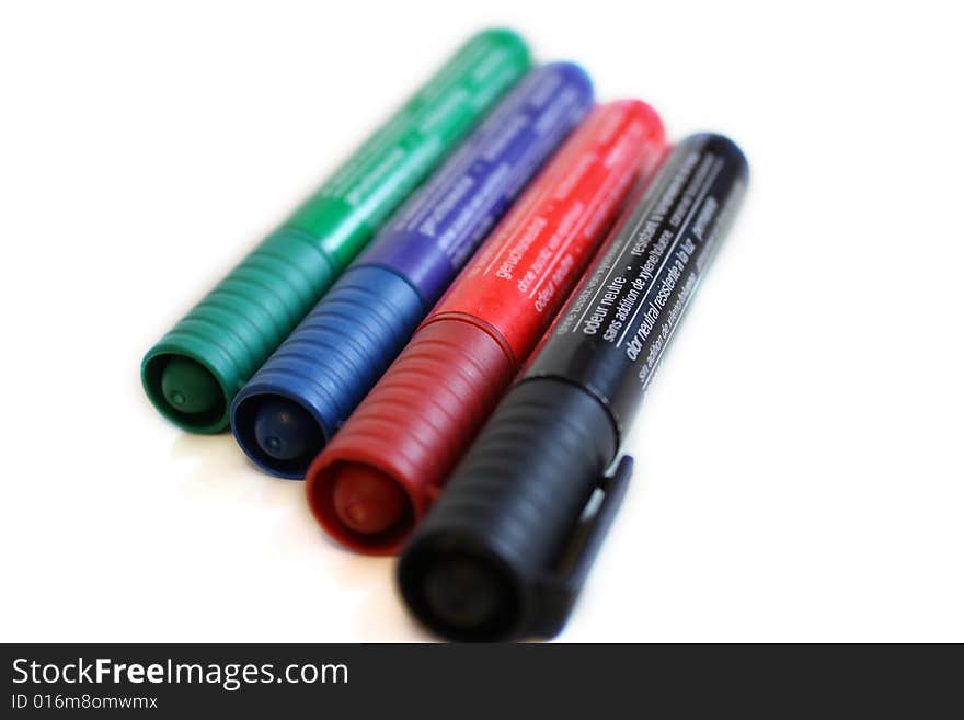 Office pen with different colors on white background