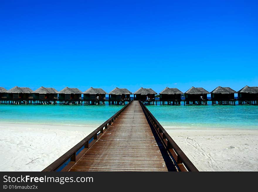 Wood bridge to house on maldivian seashore. Wood bridge to house on maldivian seashore