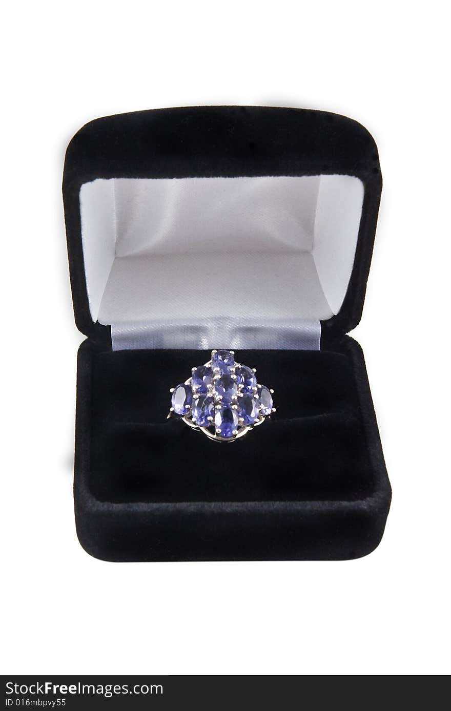 An iolite cluster ring in a box. An iolite cluster ring in a box