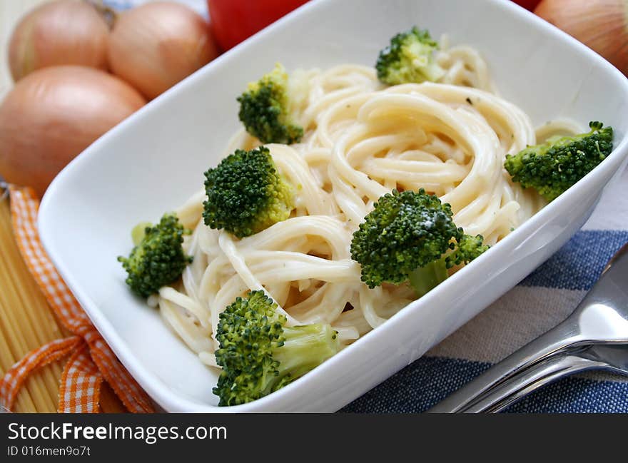 Italian noodles with cheese sauce and broccoli. Italian noodles with cheese sauce and broccoli