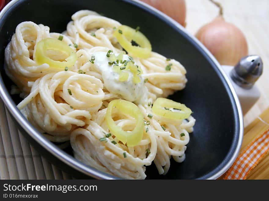 Italian noodles with cheese sauce and paprika. Italian noodles with cheese sauce and paprika