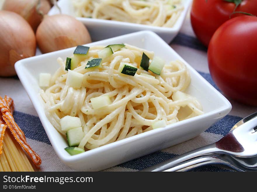 Italian noodles with cheese sauce and zucchini. Italian noodles with cheese sauce and zucchini