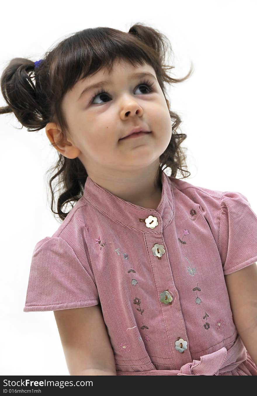 A beautiful little girl in pink dress