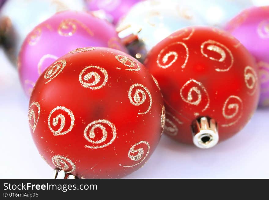 Christmas colorful balls.Focus on left red ball.