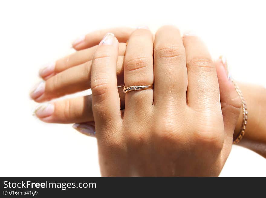 Young girl's hands close up over white