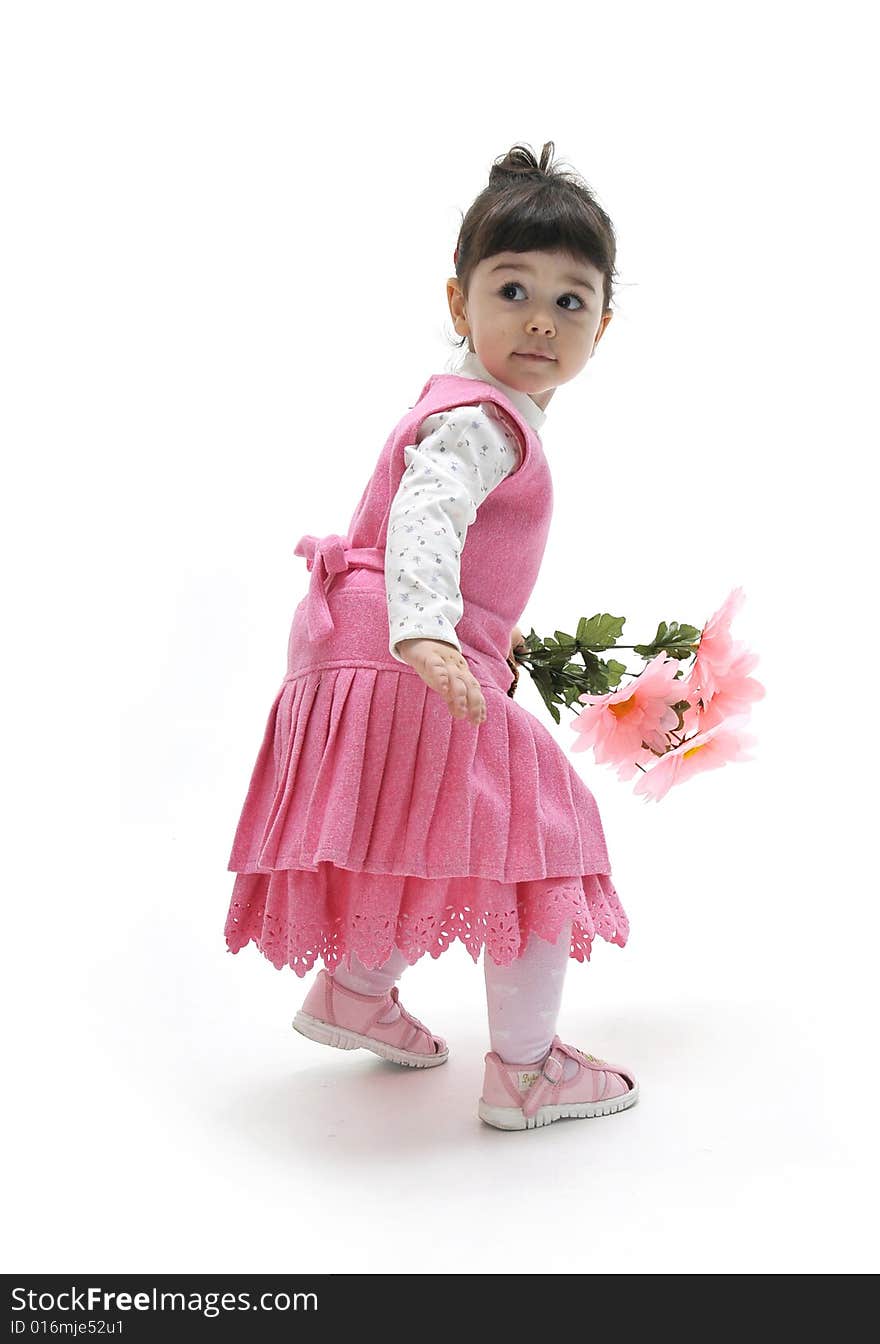 A beautiful little girl in pink dress