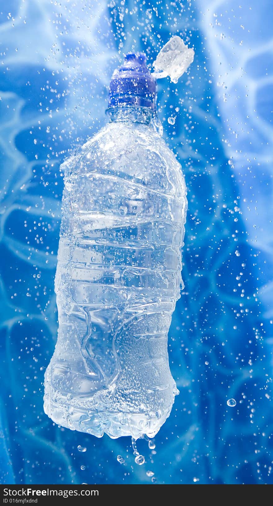 Water bottle in a water splash