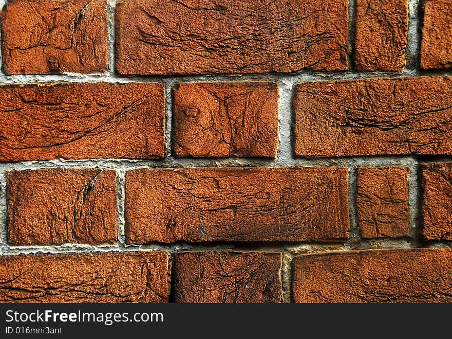 An old red brick wall background texture.