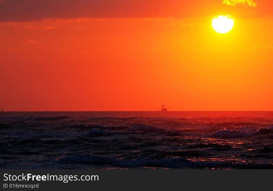 Coastal sunrise trawler