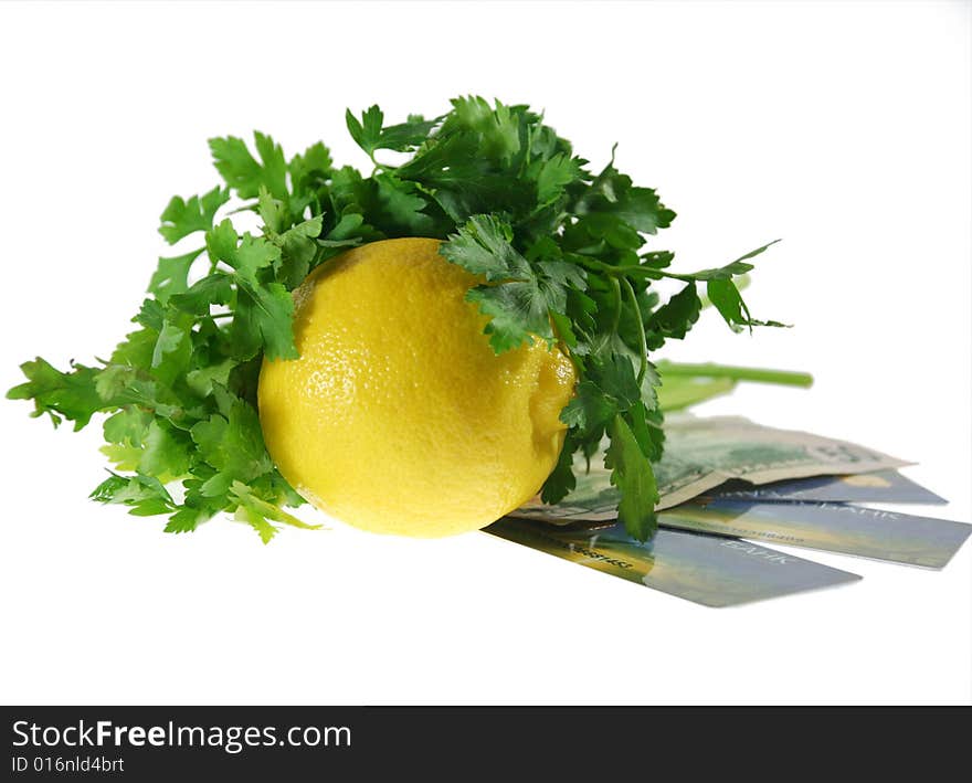 The lemon with the verdure rests upon  the money