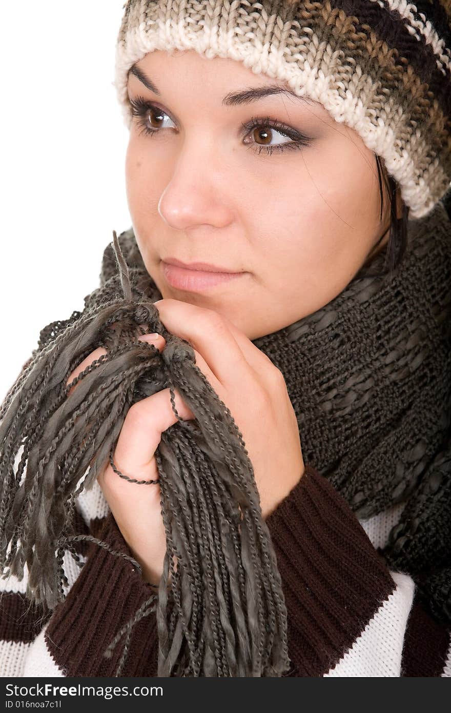 Attractive brunette winter woman. Over white background